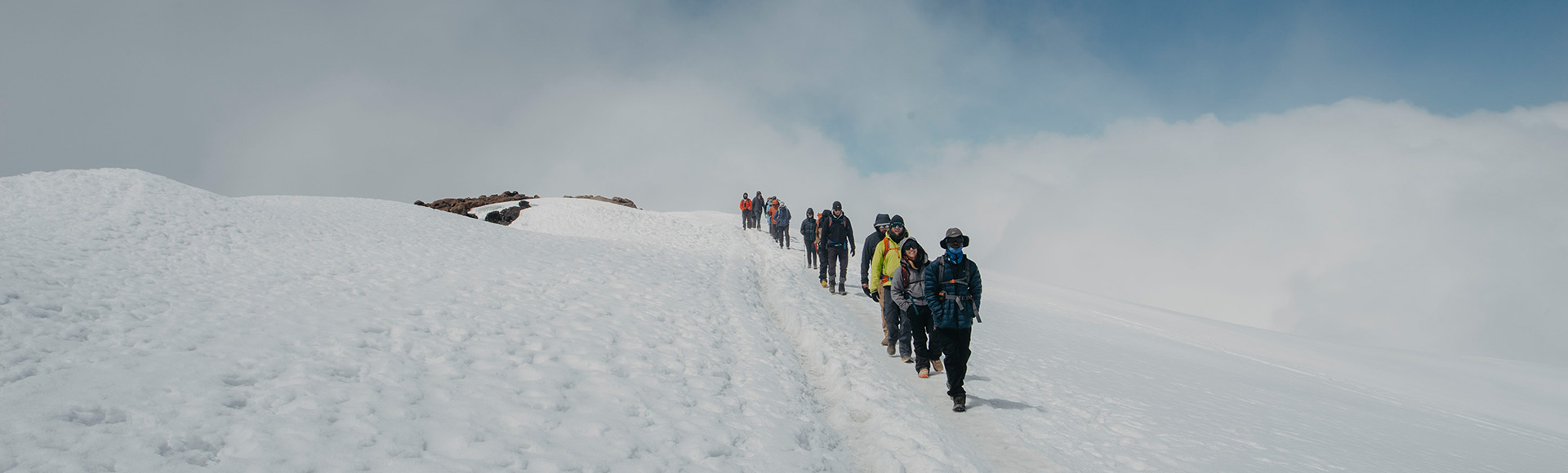 Tanzania Travelers climbers on the Kilimanjaro summit glacier trail